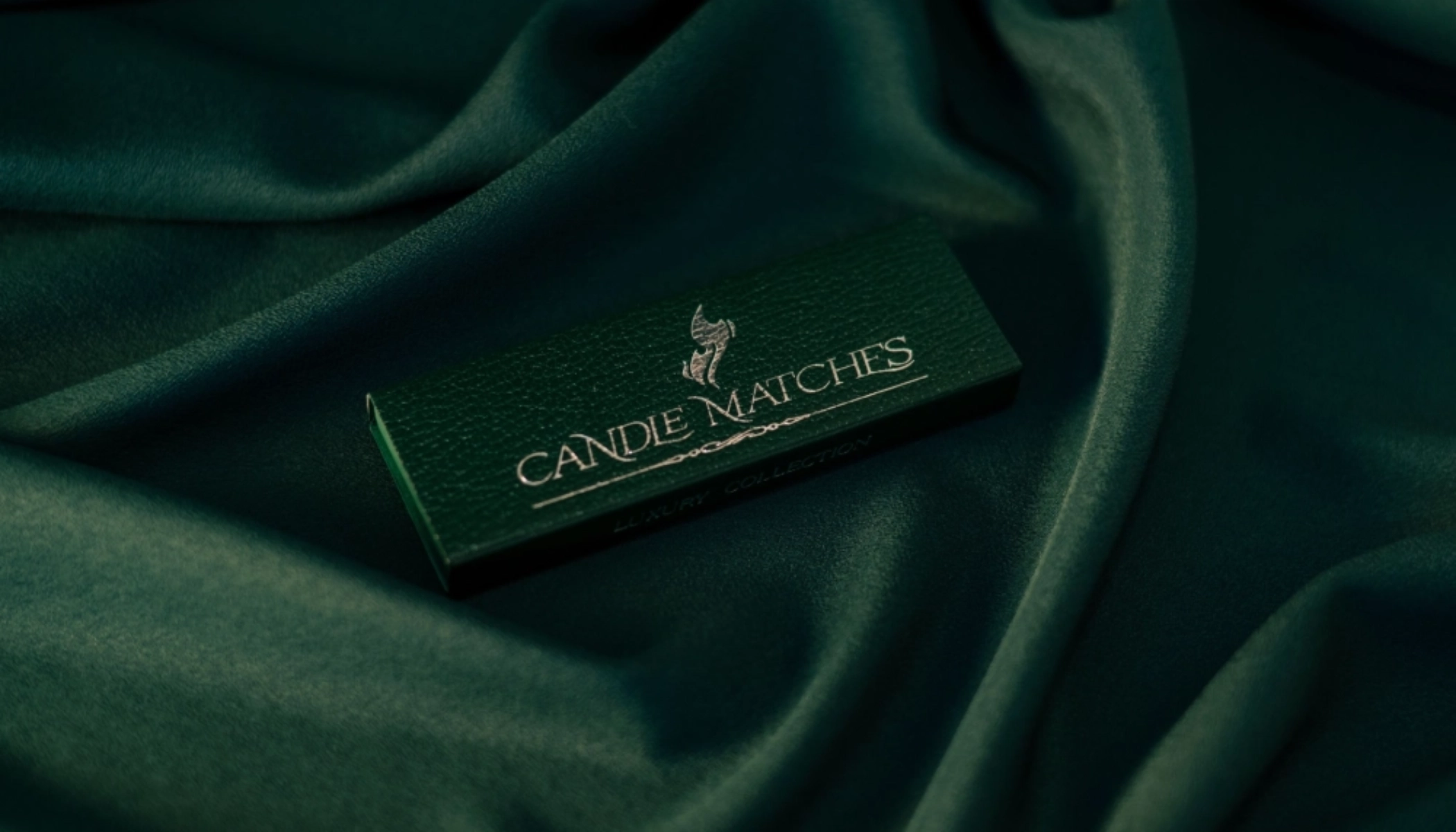 Candle matches green leather